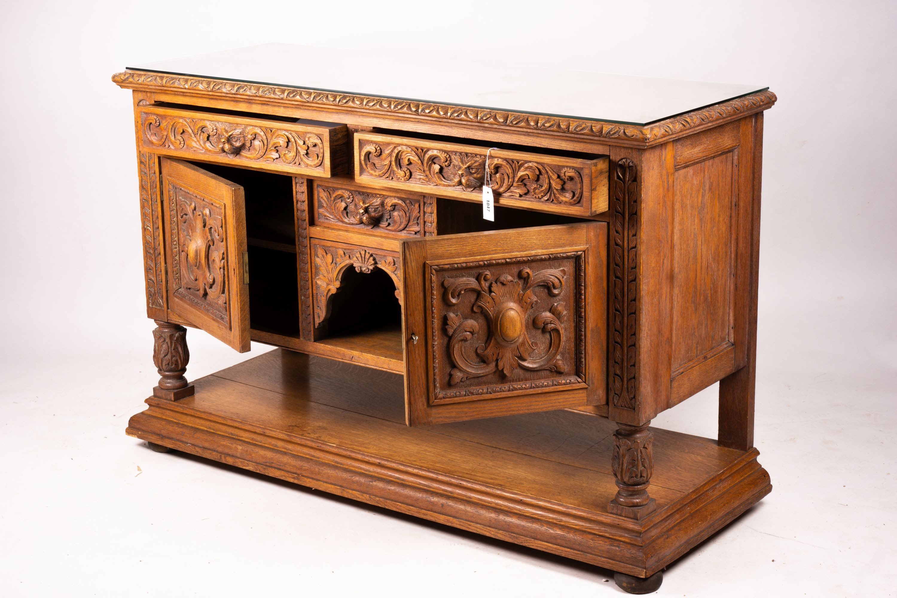 A late 19th century Flemish carved oak buffet, length 158cm, depth 58cm, height 99cm